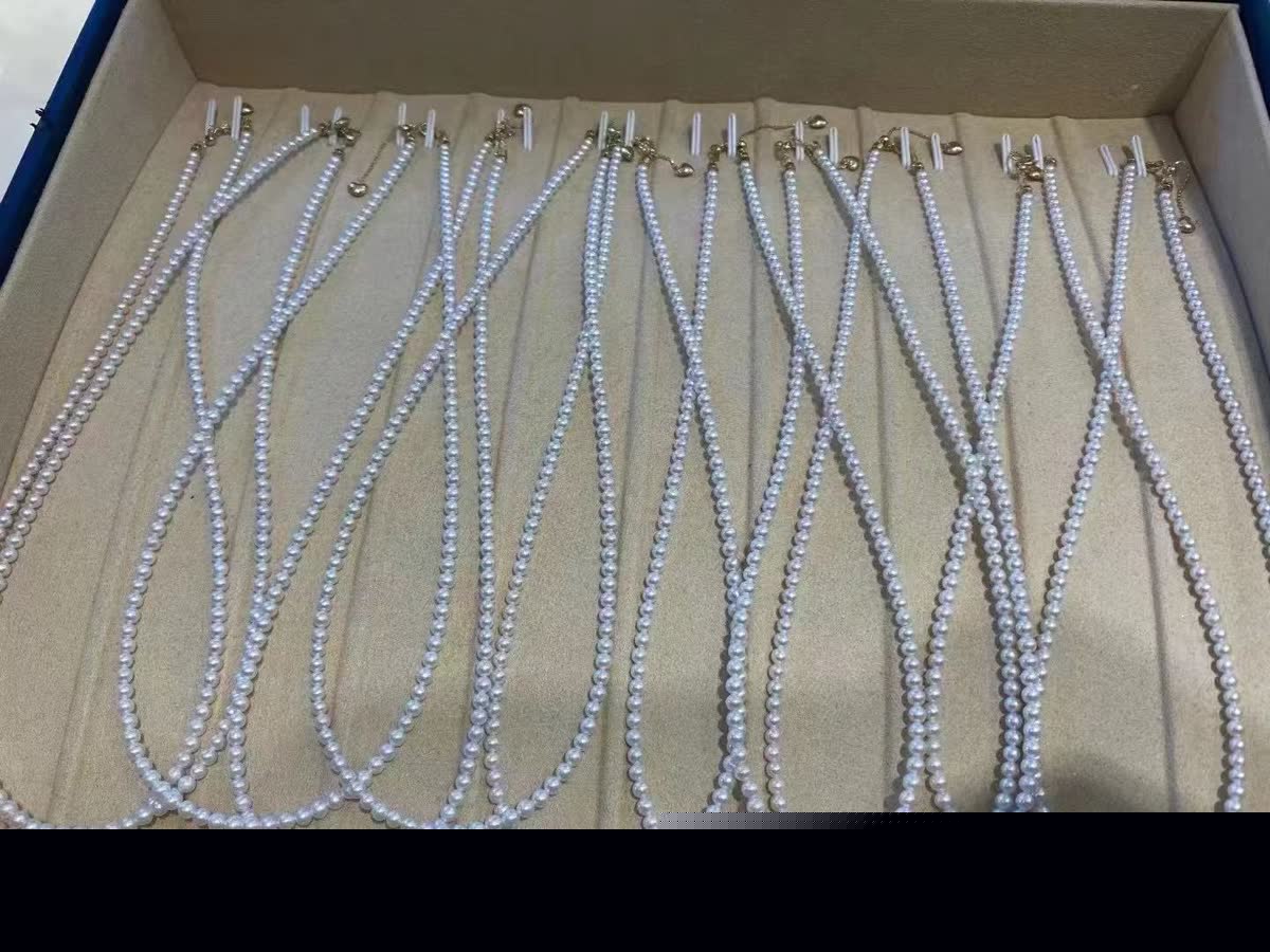 Pearl necklace batch arranged in a presentation box